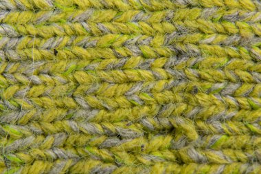 Açık yeşil örgü örülmüş kumaş kazakların arka planı