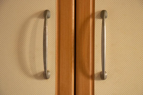 brown kitchen cabinet door handles in the kitchen