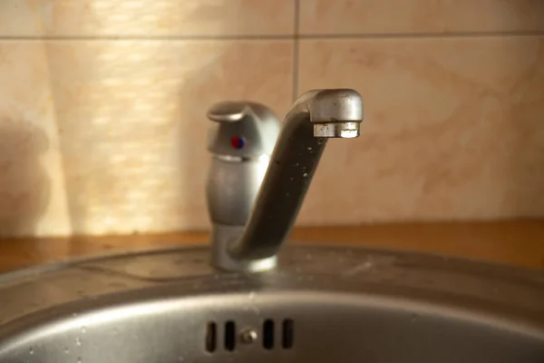 cold and hot water tap in the kitchen sink