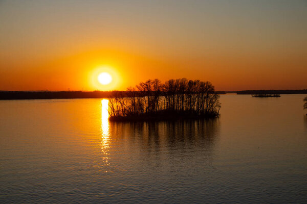 sunset on the banks of the Dnieper river among trees in Ukraine in the Dnieper cities