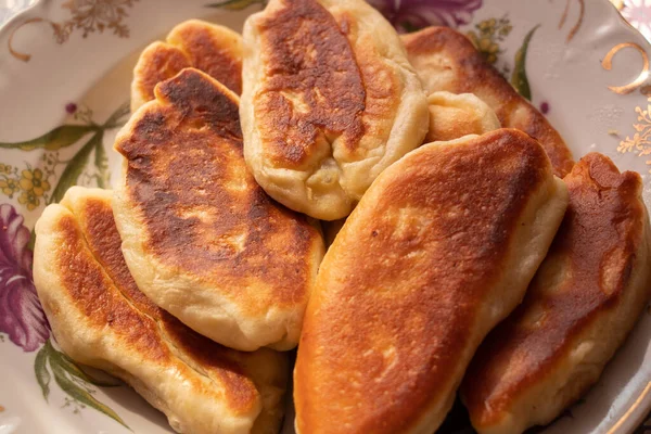 homemade fried pies with potatoes on a plate