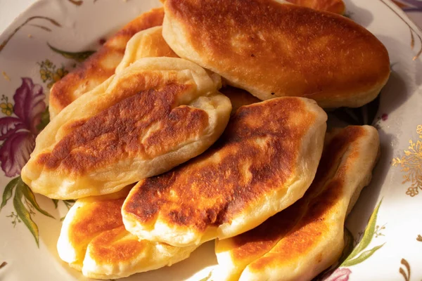 homemade fried pies with potatoes on a plate