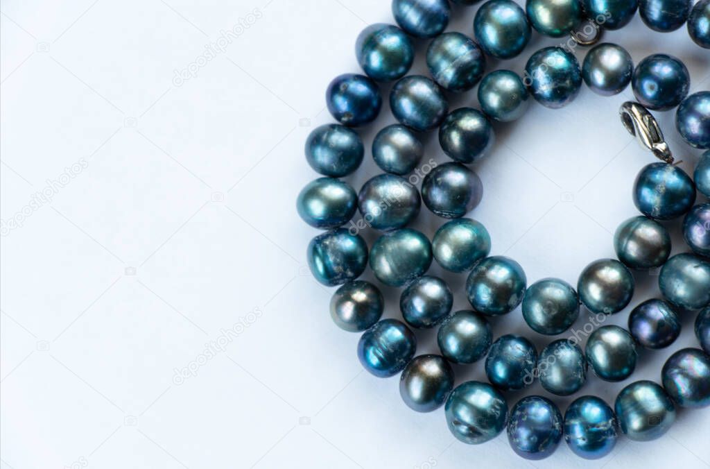 pearl female beads on an isolated background close-up