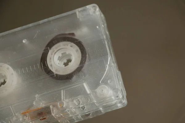 Old music cassette lies on a mirror