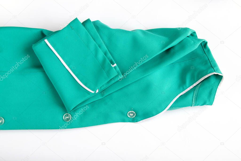 medical uniform set folded on isolated background nurse