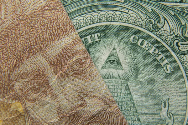一个乌克兰格里夫尼亚和一个美元作为背景宏观 — 图库照片
