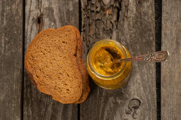 Mustard Sauce Glass Jar Next Piece Bread — Stock Photo, Image