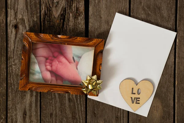 Photo Frame Photograph Foot Newly Born Baby Table Next Sheet — Stock Photo, Image
