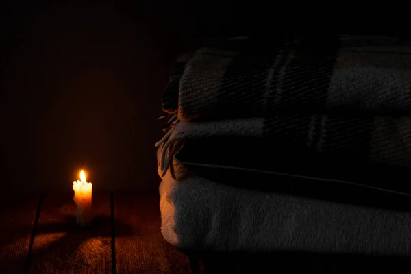 Blanket Pillow Folded Stack Background Fire Candles Dark Bedroom — Stock Photo, Image