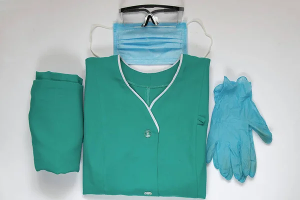 medical uniform set folded on an isolated background nurse