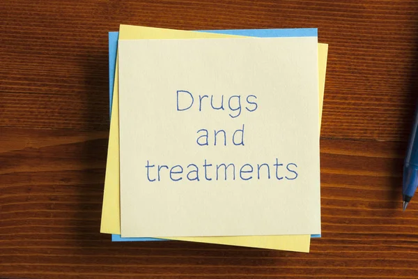 Drugs and treatments written on a note — Stock Photo, Image