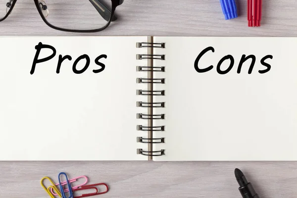 Pros and Cons written in notebook