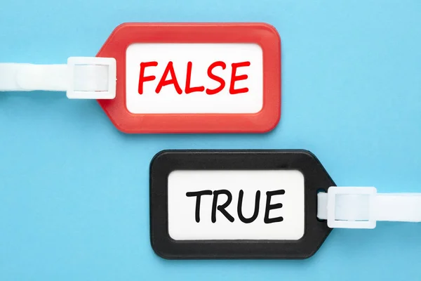 True or false written on luggage tags