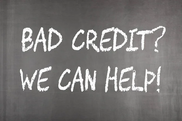 Bad credit and we can help written on blackboard.
