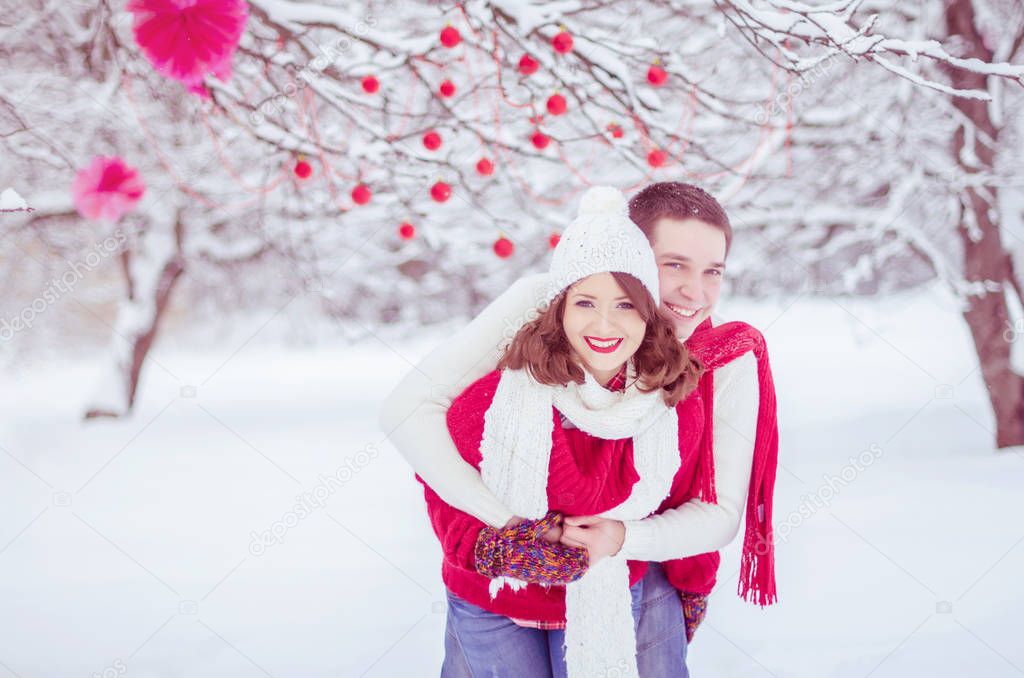 Enamored pair on a background of a winter landscape