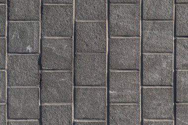 Kare, desenli, gri kaldırımlı düz çizgiler.