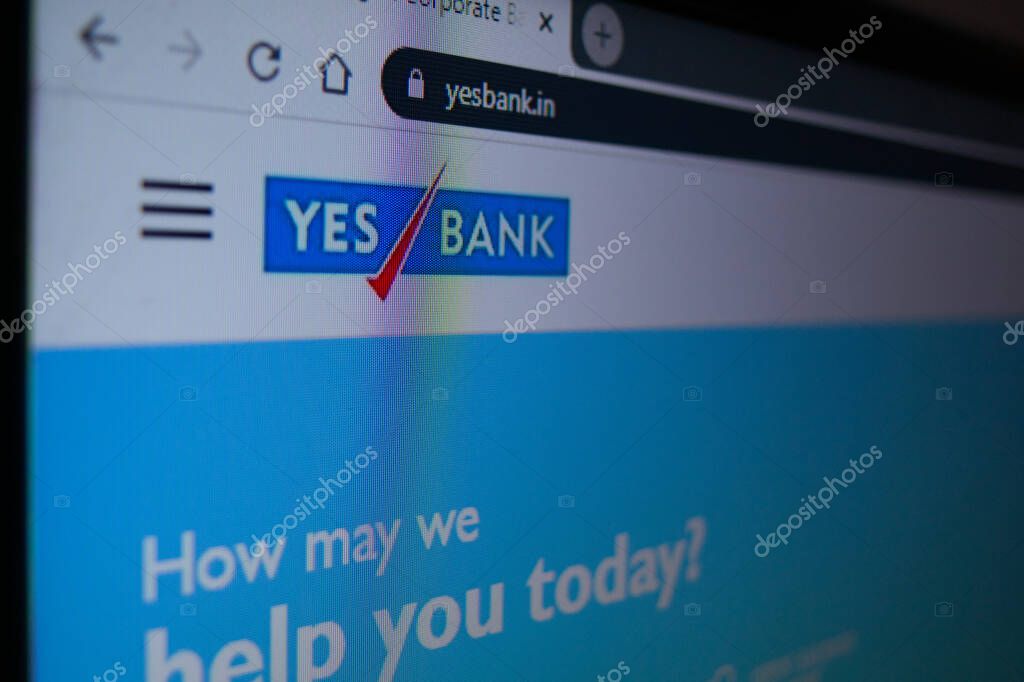 Jaipur, India, Circa 2020 - Photograph of Laptop or Television screen showing the Yes Bank website. The website is has a white background, blue logo.