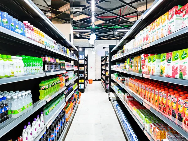 Aisles filled with juices, coconut water, soft drinks from B natural real thumbs up paper boat and more in a modern retail store — Stock Photo, Image