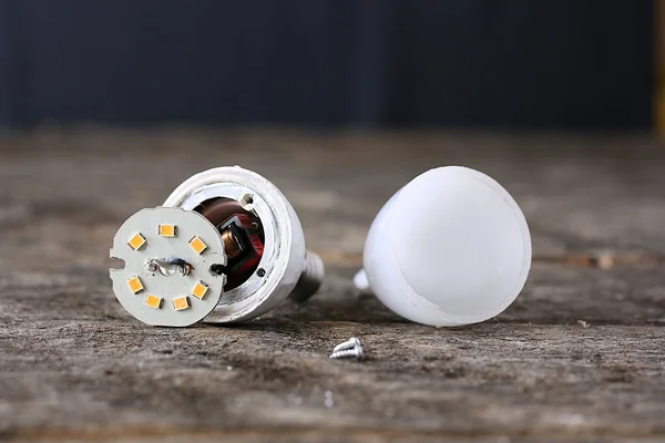 Components Led Light Bulb Dark Table — 스톡 사진