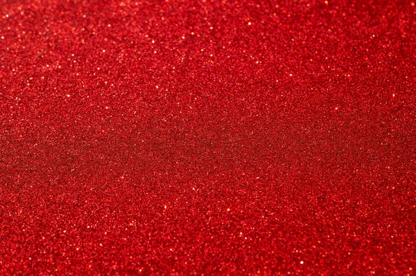 Festivo abstrato vermelho brilho textura fundo. Fundo colorido com manchas brilhantes e brilhantes. Adequado para o Natal, ano novo, ano novo chinês e desenhos. Foco seletivo — Fotografia de Stock