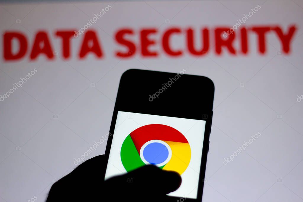 December 11, 2019. In this photo illustration the Google Chrome logo is seen displayed on a smartphone and red alerting word Data Security on the blurred background. Conceptual photo for data breach.