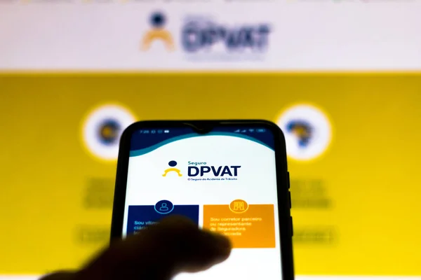 January 16, 2020, Brazil. In this photo illustration the DPVAT logo (Personal Injury by Land Motor Vehicles) is seen on a smartphone — Stock Photo, Image