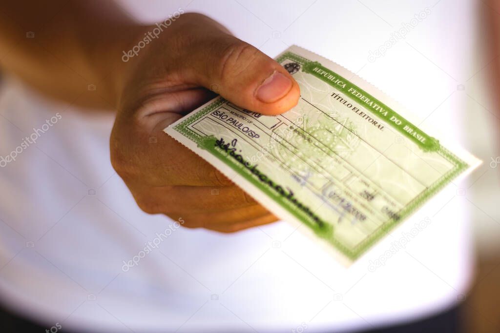 January 7, 2020, Brazil. Man holds the Voter License (iTtulo Eleitoral). It is a document that proves that the person is able to vote in Brazil elections.