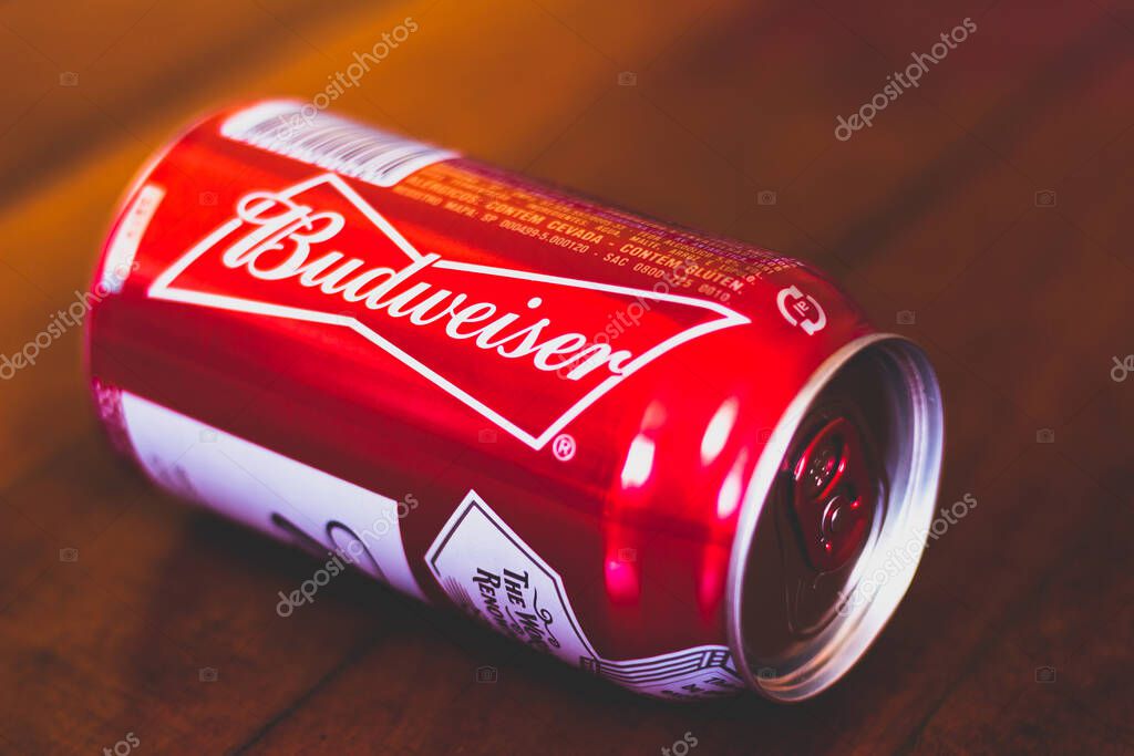 January 10, 2020, Brazil. Budweiser beer can on wooden background. Drink is sold by Anheuser-Busch.
