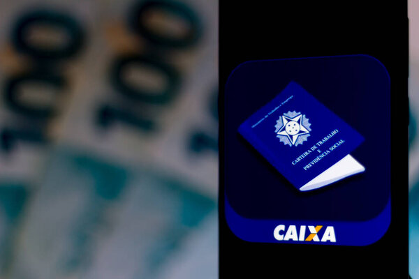 April 3, 2020, Brazil. In this photo illustration a Caixa Trabalhador logo seen displayed on a smartphone.
