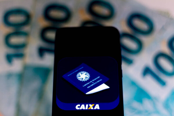 April 3, 2020, Brazil. In this photo illustration a Caixa Trabalhador logo seen displayed on a smartphone.