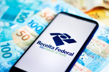 April 26, 2020, Brazil. In this photo illustration the app Receita Federal - Meu Imposto de Renda logo is displayed on a smartphone. clipart