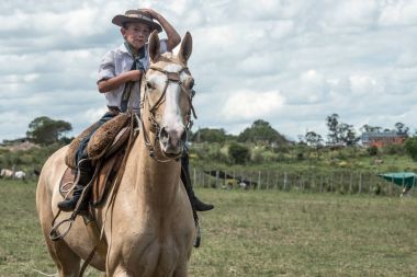 Young gaucho participates in the Traditional Fest in Marelli, Uruguay clipart