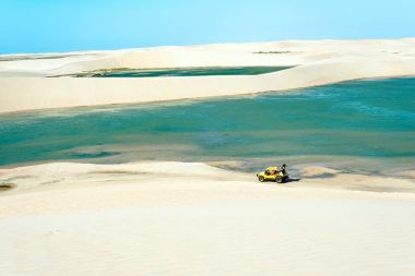 Buggy with tourists traveling through the desert Jericoacoara Na clipart