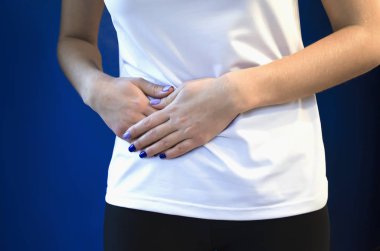 My side hurts. Care of health. girl