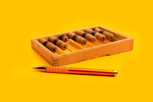 Wooden Abacus Yellow Pen Yellow Background — Stock Photo, Image