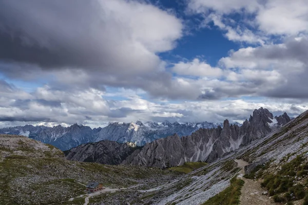 Scenic view of mountain against cloudy sky on sunny day — Stock Photo, Image