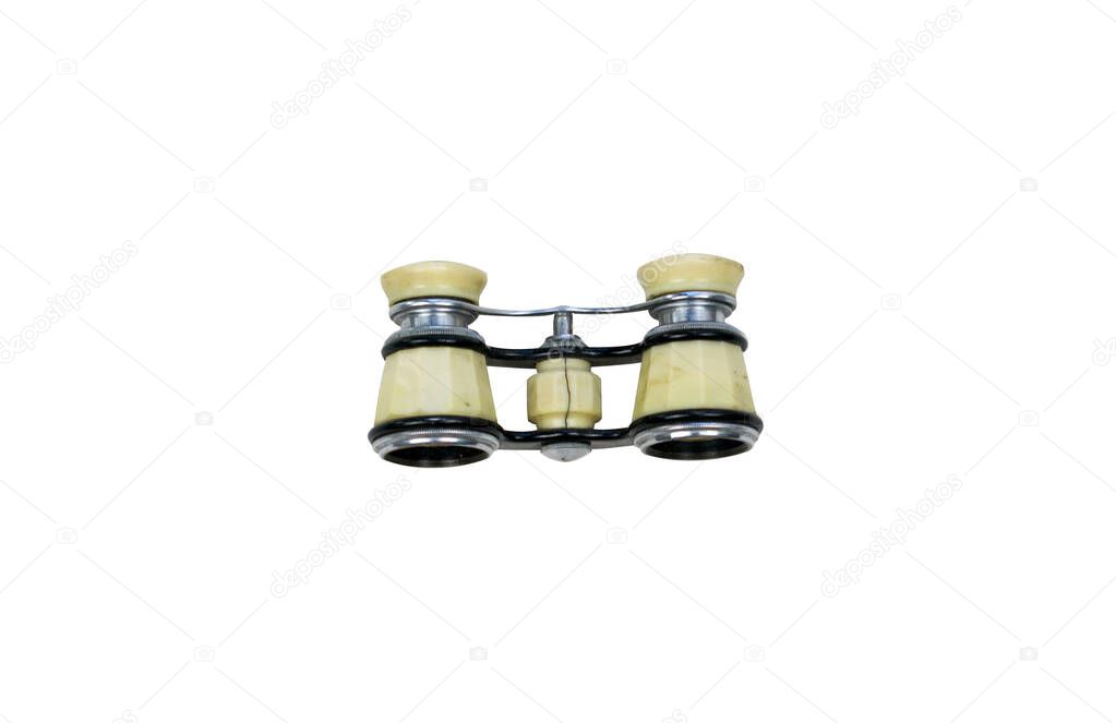 Isolated opera glasses on a white background. Old vintage ivory pair of opera glasses. Elegant small theater binocular.