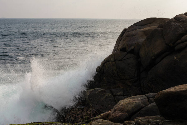 sea landscape, waves of the ocean are broken against the rocks, sri-lanka