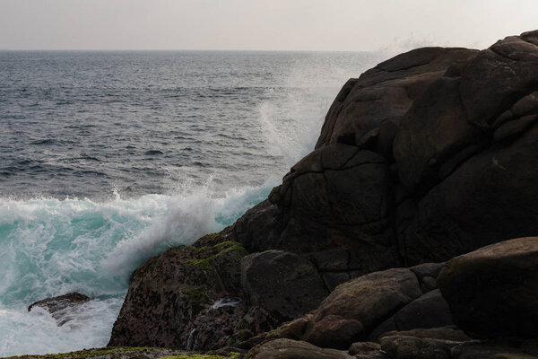 sea landscape, waves of the ocean are broken against the rocks, sri-lanka