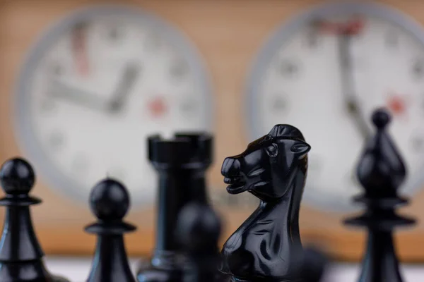 Boys play chess with a clock to control time Vector Image