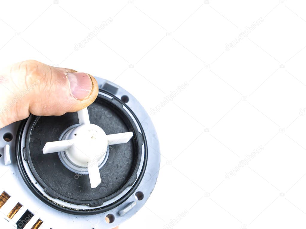 Motor pump with impeller of a washing machine on a white background.