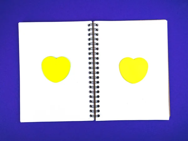 Notebook for notes with a heart symbol.