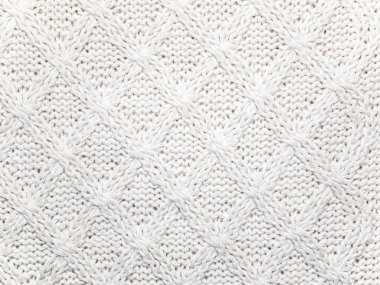 Beyaz yün örgü kumaş dokusu.