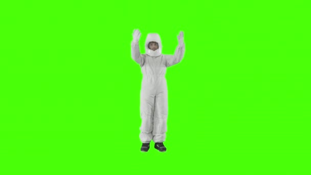 Man in a spacesuit stands and shows something with his hands — Stock Video