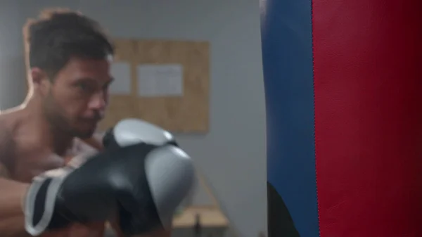 Man punches a punching bag, slow motion — 스톡 사진