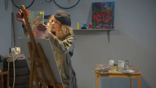 Woman chooses a picture to redraw it