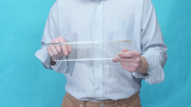 A man pokes the screen of a glass tablet — Stock Video