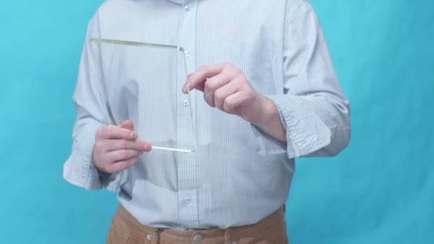 Businessman stands and uses a modern tablet — Stock Video