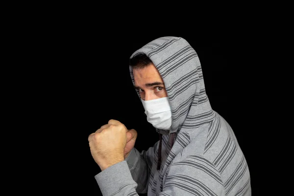 Young Man Gray Hoodie Mask Prevent Coronavirus Posing Black Background — Stock Photo, Image