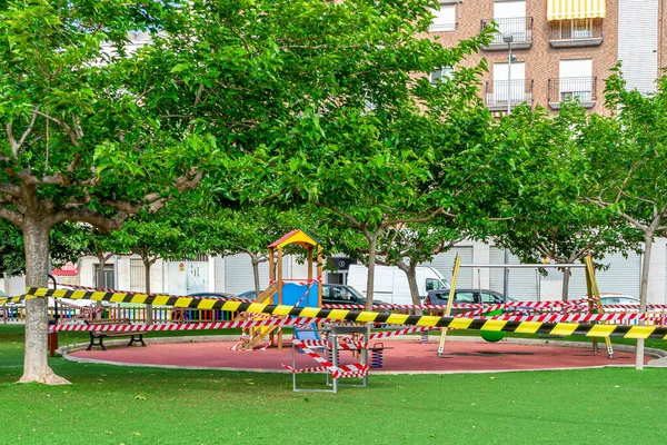 Park sealed with plastic tape so that children cannot play to avoid the spread of the coronavirus in the quarantine state